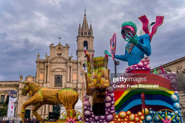 Huge floats with colourful, moving figures are pulled through the streets of the town during the Acireale Carnevale.