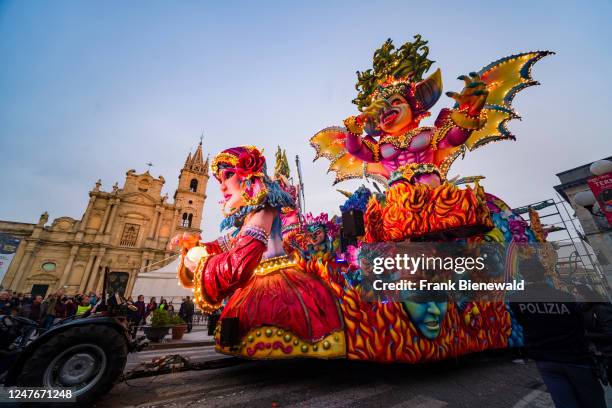 Huge floats with colourful, moving figures are pulled through the streets of the town during the Acireale Carnevale.