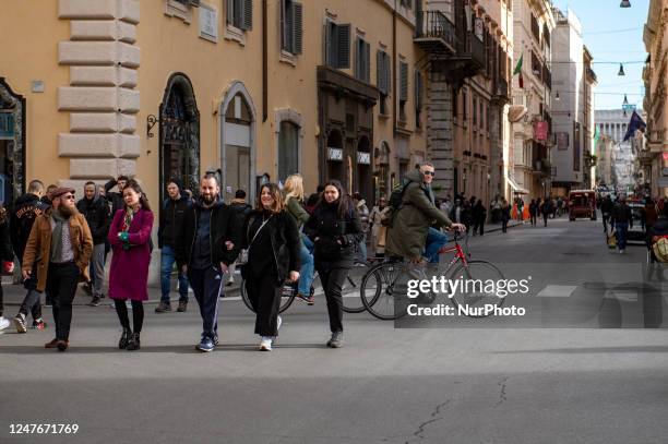 People walk in Via del Corso, in Rome Italy on March 2, 2023