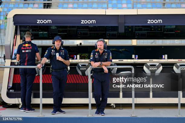 Red Bull Racing's British team principal Christian Horner and British Chief Technology Officer Adrian Newey watch the first practice session of the...
