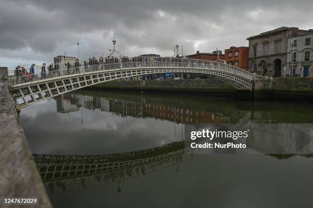 Ha'penny Bridge in the center of Dublin, Ireland, on February 17, 2023.