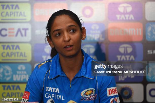 Mumbai Indians' cricket team captain Harmanpreet Kaur attends a press conference ahead of the inaugural edition of Women's Premier League , in Navi...