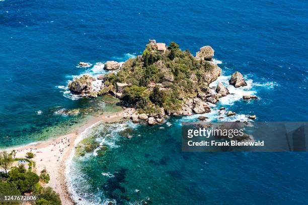 Aerial view of Isola Bella, a small island off the coast of the tourist destination of Taormina, now turned into a nature reserve.