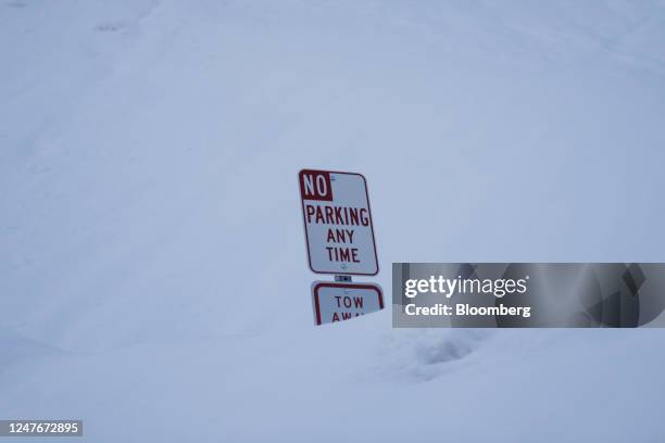 Parking sign buried in snow after a winter storm in Mt Baldy, California, US, on Thursday, March 2, 2023. A sprawling winter storm last week put a...