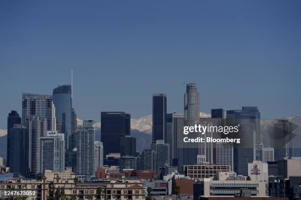 The snow-covered San Gabriel mountain range past the downtown Los Angeles skyline after a winter storm in Los Angeles, California, US, on Thursday,...