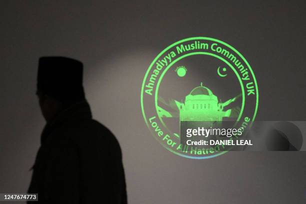 Sign is seen on a wall inside the Baitul Futuh Mosque in Morden, south west London on March 3 ahead its re-opening. - The Mosque, one of Europe's...