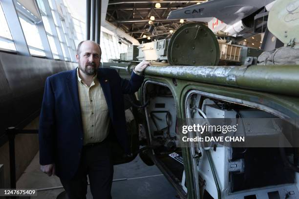 Cold War historian Andrew Burtch poses for a portrait with BRM-1K Soviet Union armored reconnaissance vehicle at the Canadian War Museum February 8,...