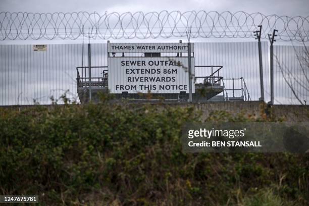 Sign warning of a 'Sewage Outfall' is pictured at the Thames Water Long Reach water treatment facility on the banks of the Thames estuary in...