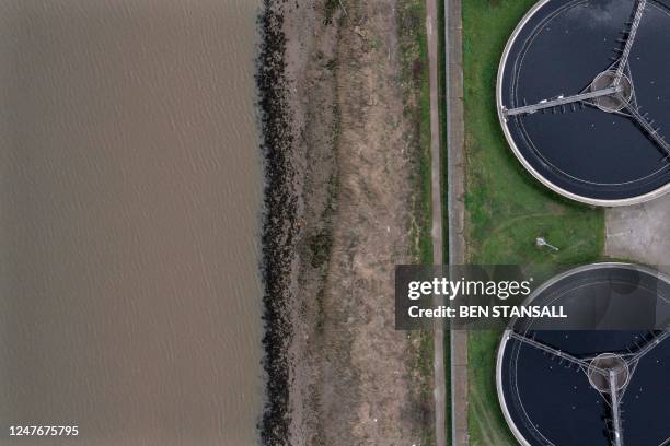 An aerial view shows the sedimentation tanks at the Thames Water Long Reach water treatment facility on the banks of the Thames estuary in Dartford,...