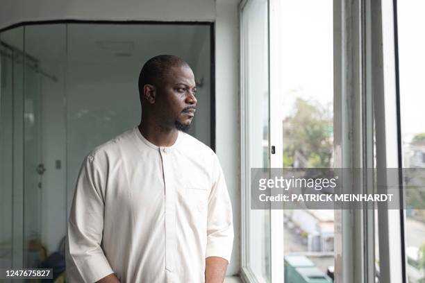 Labour Party governorship candidate for Lagos State Gbadebo Rhodes-Vivour poses for a portrait during a meeting with members of his campaign team at...