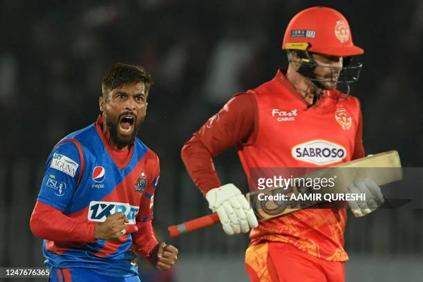 Karachi Kings' Mohammad Amir celebrates after taking the wicket of Islamabad United's Colin Munro during the Pakistan Super League T20 cricket match...