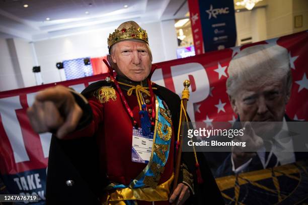 An attendee wears a mask resembling former US President Donald Trump during the Conservative Political Action Conference in National Harbor,...