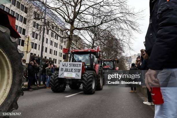 Farmers from Belgium's northern region of Flanders block a street with tractors during a protest against the regional government's nitrogen emissions...