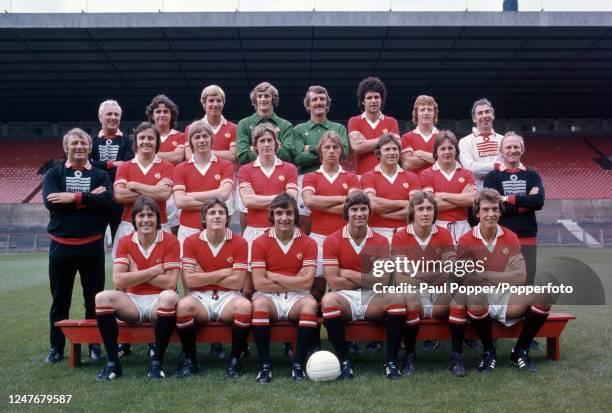 Manchester United line up for a team photograph at Old Trafford in Manchester, England, circa July 1976. Back row : Tommy Cavanagh , Arthur Albiston,...