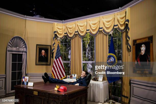 An attendee poses for a photograph in a replica of the Oval Office during the Conservative Political Action Conference in National Harbor, Maryland,...