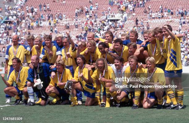 Sweden line up for a team photo after winning the FIFA World Cup third place play-off match between Sweden and Bulgaria at the Rose Bowl on July 16,...