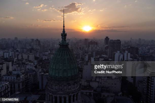 The sun sets behind the National Congress as smoke from Delta del Parana wildfires affect the environment in Buenos Aires, Argentina, on March 2,...