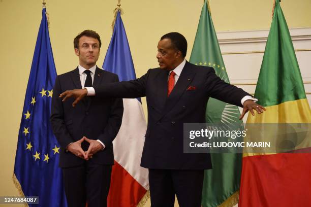 French president Emmanuel Macron and Congo's president Denis Sassou Nguesso gesture as they listen to a final declaration of a working visit at the...