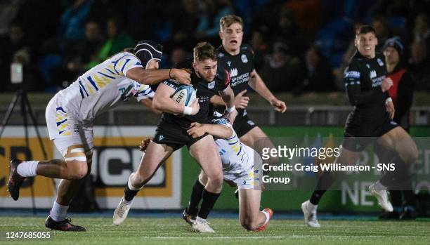 Warriors' Ollie Smith is tackled during a BKT United Rugby Championship match between Glasgow Warriors and Zebre Parma at Scotstoun Stadium, on March...