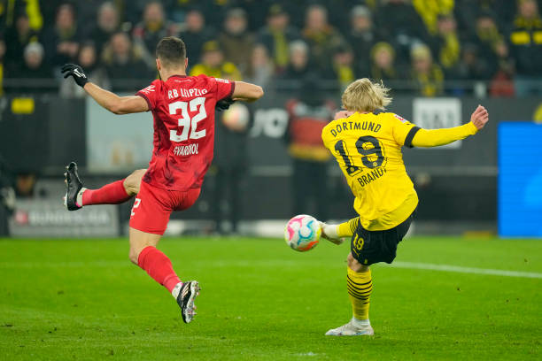 Josko Gvardiol of RB Leipzig and Julian Brandt of Borussia Dortmund battle for the ball during the Bundesliga match between Borussia Dortmund and RB...