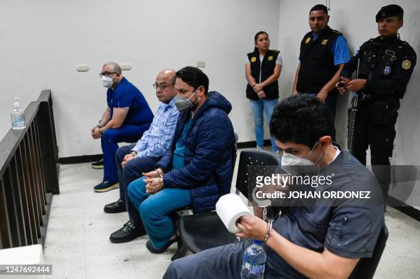 Guatemalan doctors Angel Valdez, Danny Chocoj, Orlando Rodas, and Mario Bolanos are seen after a hearing in a human trafficking crime court, in...