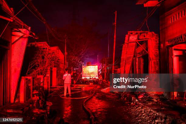 General view of burnt houses is seen after a fire broke out at a fuel storage station operated by Indonesia's state energy company Pertamina, in...