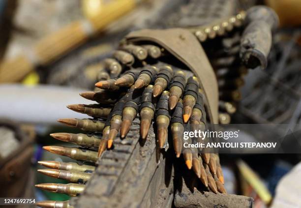 This photograph taken on March 3 shows a view of a machine gun and ammunition cartridges in Bakhmut, in the Donetsk region on March 3, 2023.