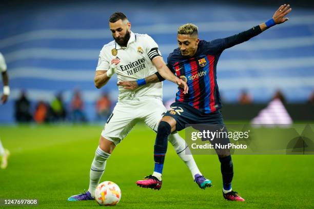 Karim Benzema centre-forward of Real Madrid and France and Raphinha right winger of Barcelona and Brazil compete for the ball during the Copa del Rey...