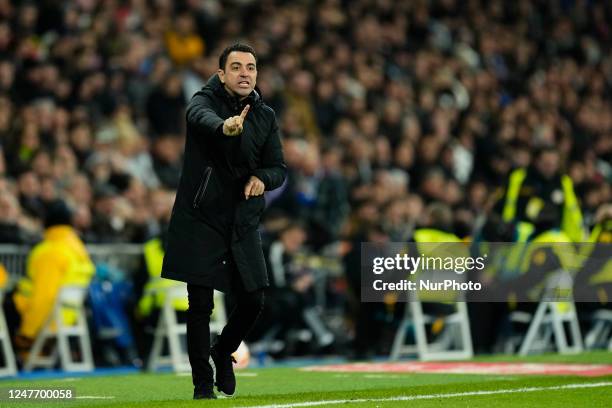 Xavi Hernandez head coach of Barcelona gives instructions during the Copa del Rey semi-final first leg match between Real Madrid and FC Barcelona at...