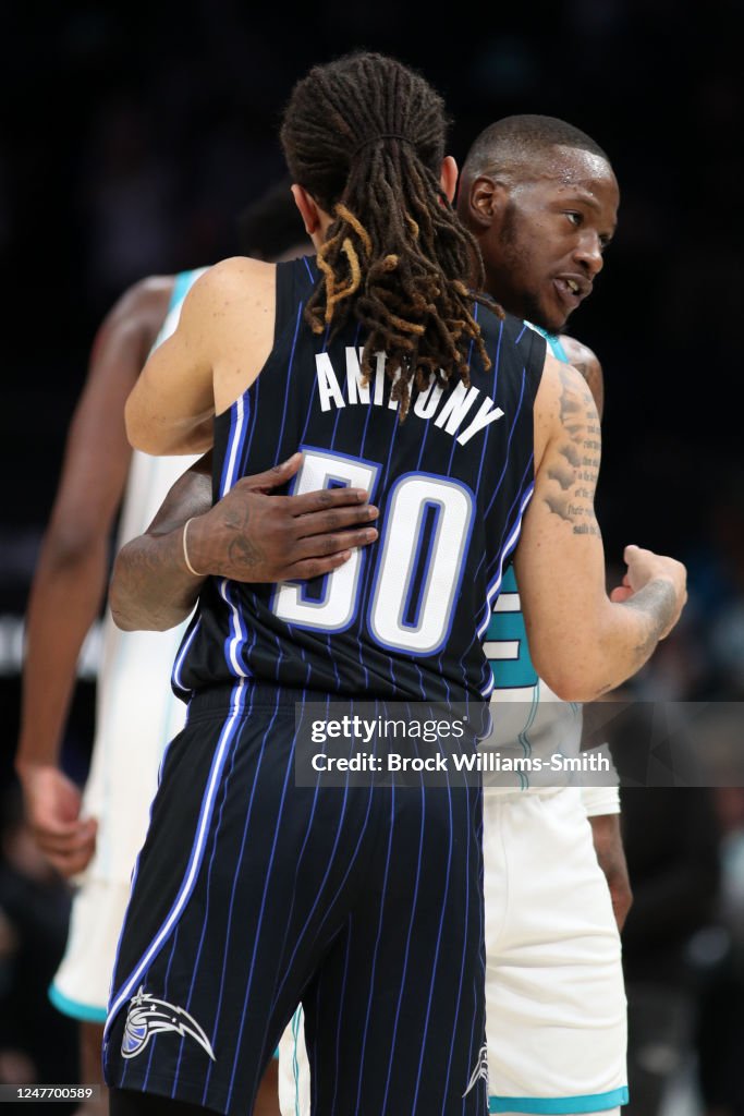 Terry Rozier of the Charlotte Hornets embraces Cole Anthony of the ...