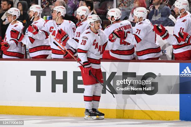 Sebastian Aho of the Carolina Hurricanes celebrates with teammates on the bench after scoring a goal against the Arizona Coyotes during the first...