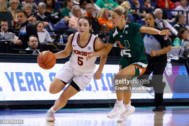 Georgia Amoore of the Virginia Tech Hokies dribbles the ball against Hanna Cavinder of the Miami Hurricanes during the second half of their game in...