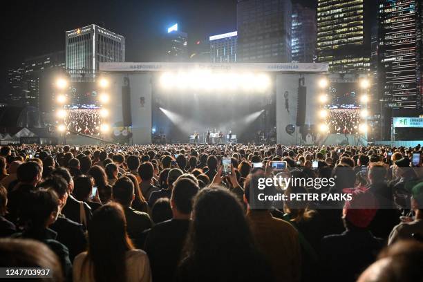 In this picture taken on March 3 the crowd watches French band Phoenix perform at the Clockenflap music festival in Hong Kong.