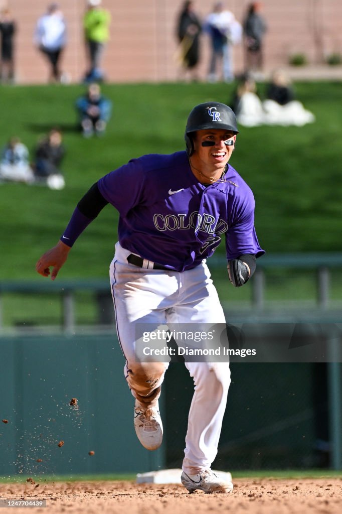 Drew Romo C Drew Romo of the Colorado Rockies runs toward third base during the ...
