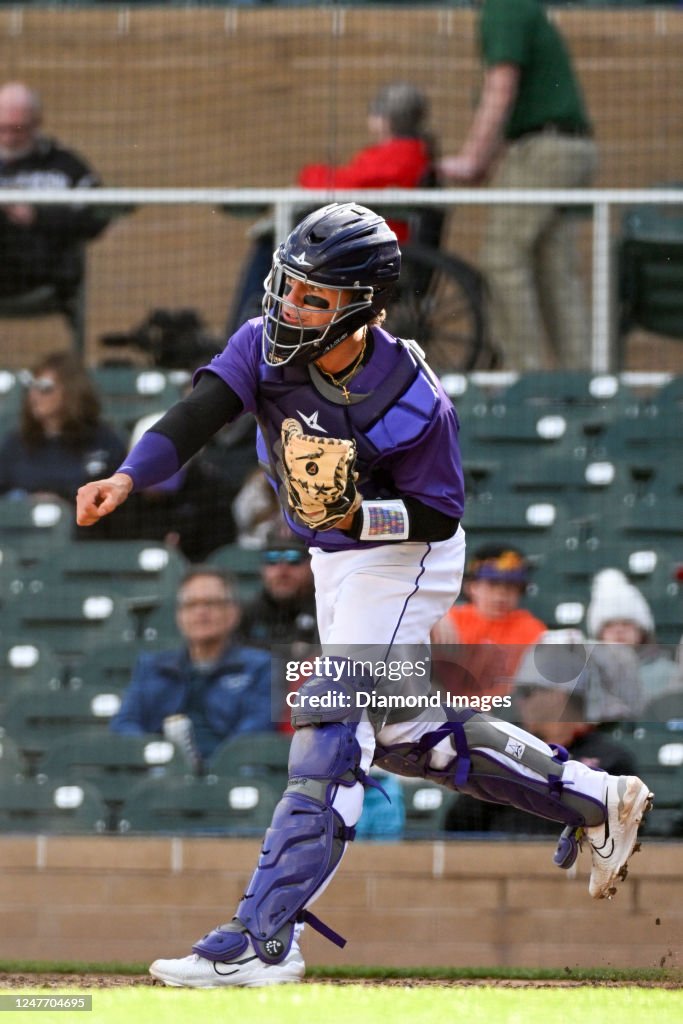 Drew Romo C Drew Romo of the Colorado Rockies warms up during the ninth inning of ...
