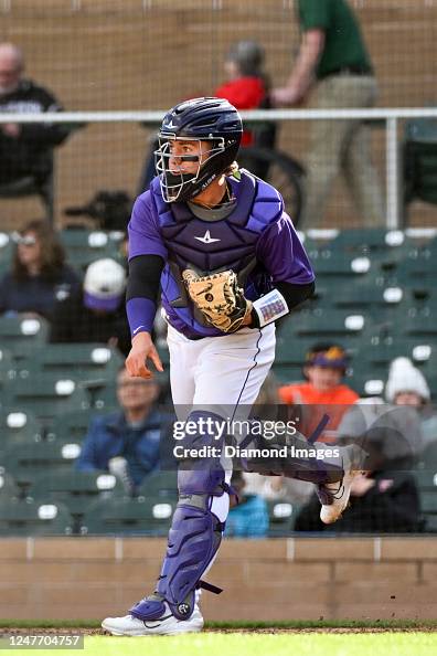 Drew Romo C Drew Romo of the Colorado Rockies warms up during the ninth inning of ...
