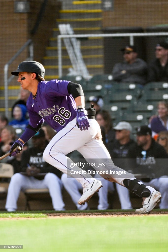 Drew Romo C Drew Romo of the Colorado Rockies runs out an RBI infield single ...