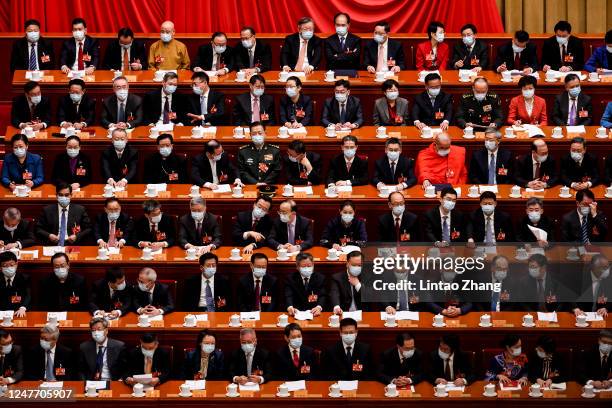 Delegates attend the opening of the first session of the 14th Chinese People's Political Consultative Conference at The Great Hall of People on March...