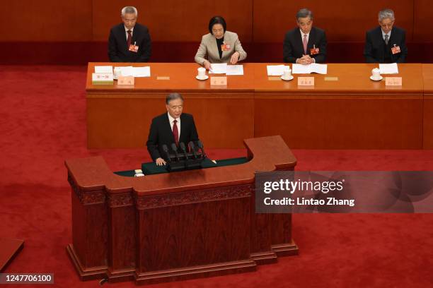 Wang Yang, chairman of the National Committee of the Chinese People's Political Consultative Conference delivers his report during the opening...