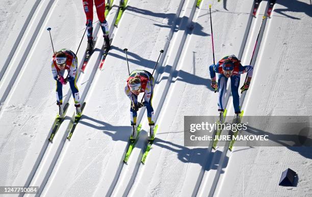 Sweden's Ebba Andersson , Sweden's Frida Karlsson and Finland's Kerttu Niskanen compete in the Womens Cross-Country 30km Mass Start Classic...