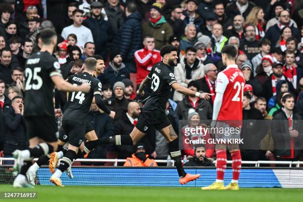 Bournemouth's Danish midfielder Philip Billing celebrates after scoring his team first goal during the English Premier League football match between...