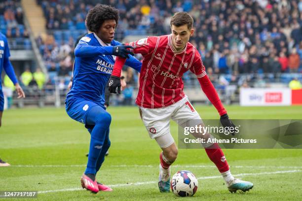 Jaden Philogene of Cardiff City pressures Anis Mehmeti of Bristol City during the Sky Bet Championship match between Cardiff City and Bristol City at...