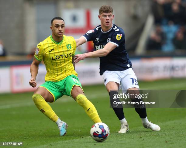 Adam Idah of Norwich City and Charlie Cresswell of Millwall during the Sky Bet Championship match between Millwall and Norwich City at The Den on...