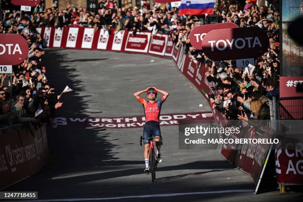 Team Ineos' Thomas Pidcock celebrates as he crosses the finish line to win the 17th one-day classic 'Strade Bianche' cycling race, 184 km between...