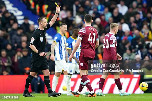 West Ham United's Declan Rice is shown a yellow card by referee... News ...