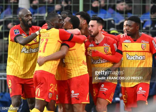 Lens' players celebrate after scoring a goal during the French L1 football match between Lens and Lille and the Bollaert-Delelis stadium in Lens on...