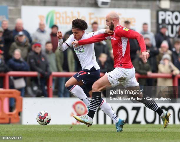 Bolton Wanderers' Shola Shoretire holds off the challenge from Morecambe's Farrend Rawson during the Sky Bet League One between Charlton Athletic and...