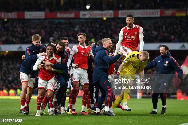 Arsenal's English midfielder Reiss Nelson celebrates after scoring his team third goal of the team during the English Premier League football match...