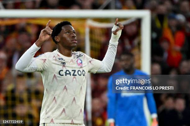 Lille's Canadian forward Jonathan David celebrates after scoring a goal during the French L1 football match between Lens and Lille and the...