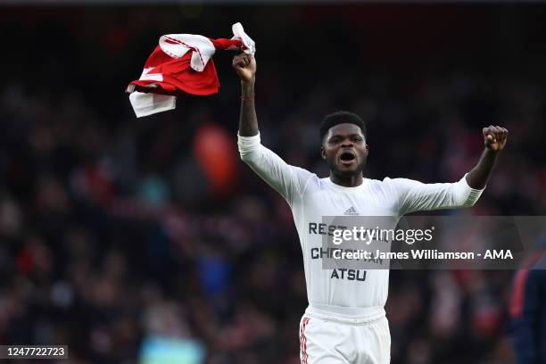 Thomas Partey of Arsenal celebrates at full time while wearing a T Shirt which says Rest Well Christian Atsu after the Premier League match between...